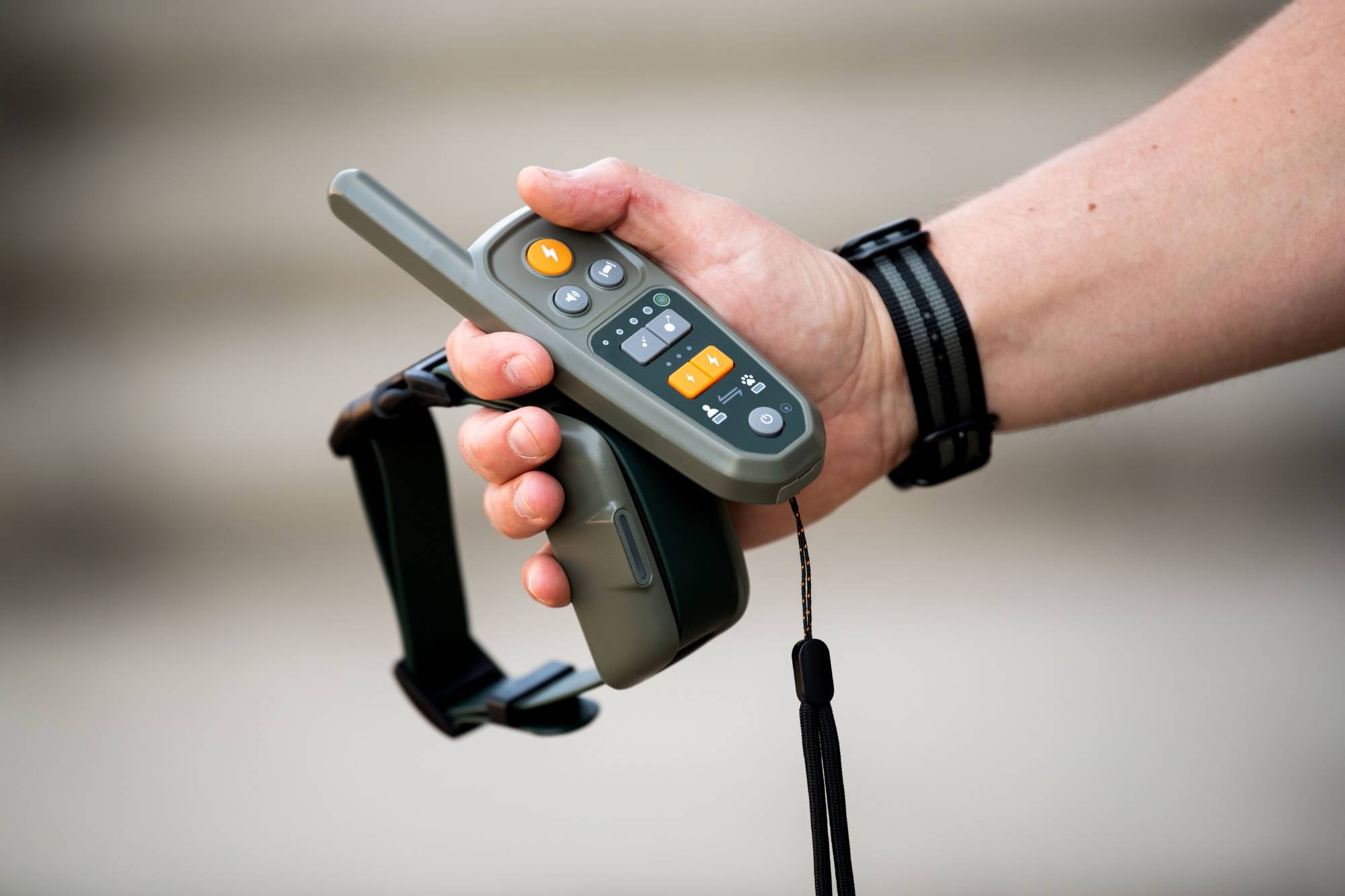 Nick Hayhoe holds the Heel controller and collar